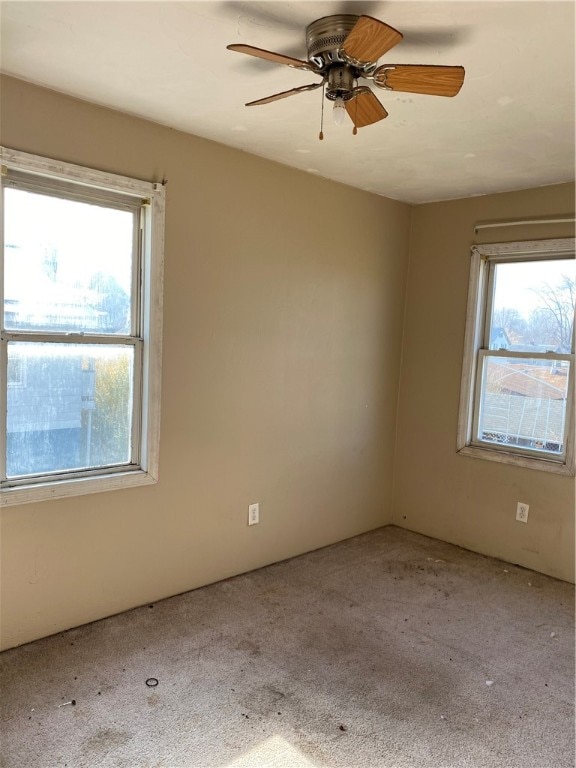 carpeted empty room with ceiling fan