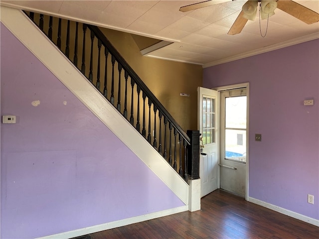 staircase with ceiling fan, wood-type flooring, and ornamental molding