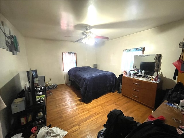 bedroom featuring ceiling fan and light wood-type flooring