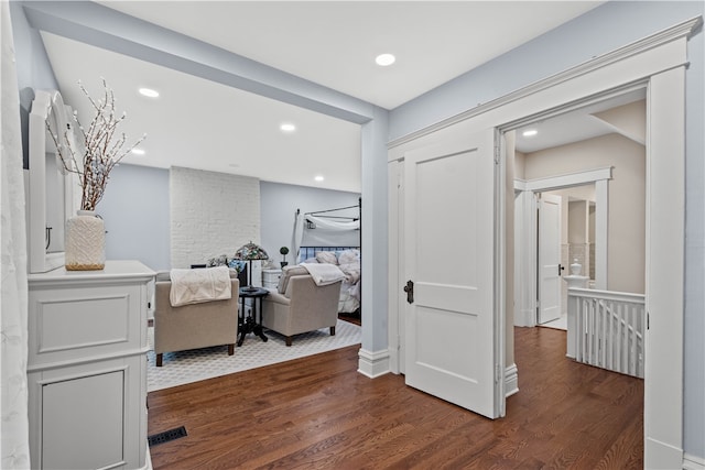 bedroom featuring dark hardwood / wood-style flooring