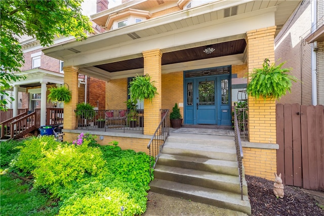 property entrance featuring a porch