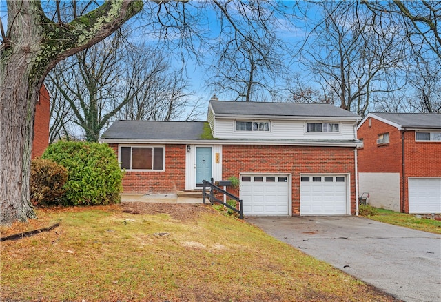 view of front of property featuring a garage and a front lawn