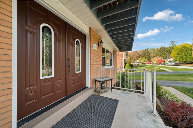 doorway to property featuring covered porch