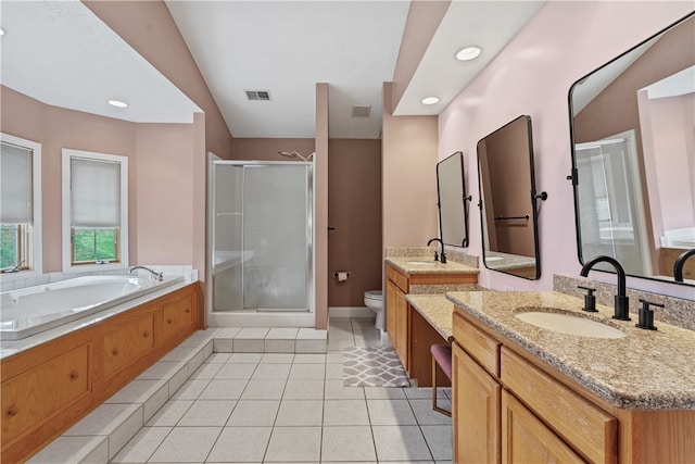 full bathroom with tile patterned floors, vanity, separate shower and tub, and toilet