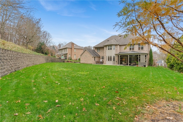 view of yard featuring a sunroom