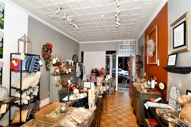 interior space featuring rail lighting and light parquet floors