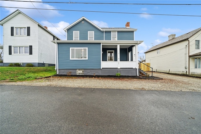 view of property featuring a porch