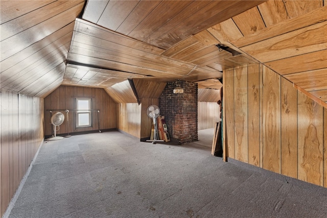 additional living space featuring carpet flooring, wooden walls, wooden ceiling, and vaulted ceiling