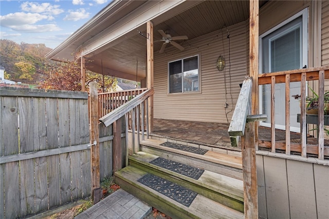 entrance to property featuring ceiling fan