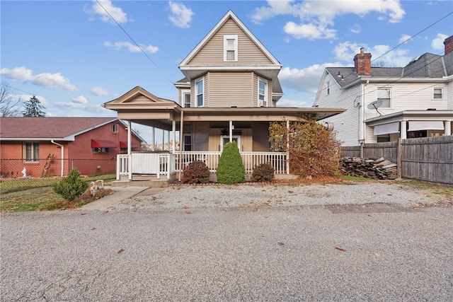 view of front property featuring covered porch