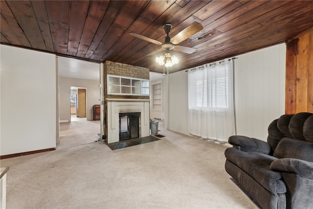 living room featuring a fireplace, light carpet, ceiling fan, and wooden ceiling