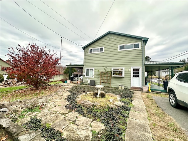 exterior space featuring a carport and central AC