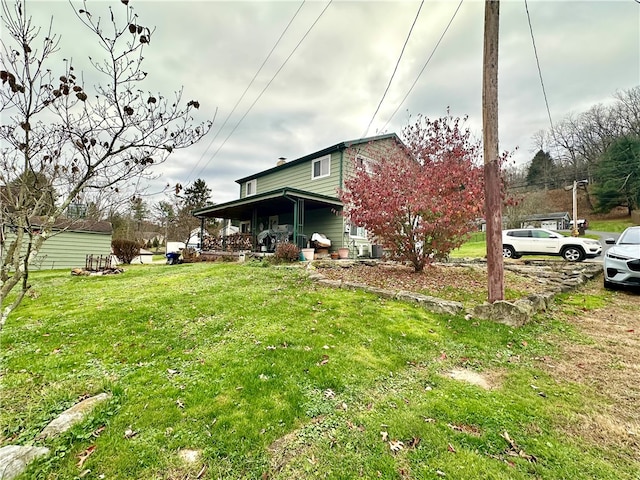 view of yard featuring covered porch