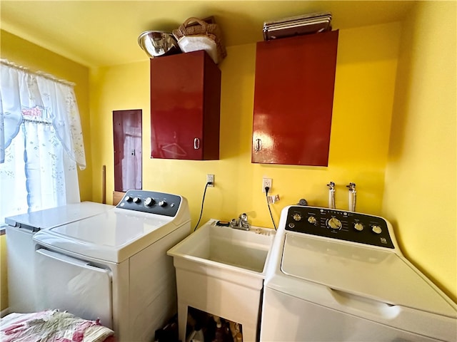 laundry area with sink and washer and dryer