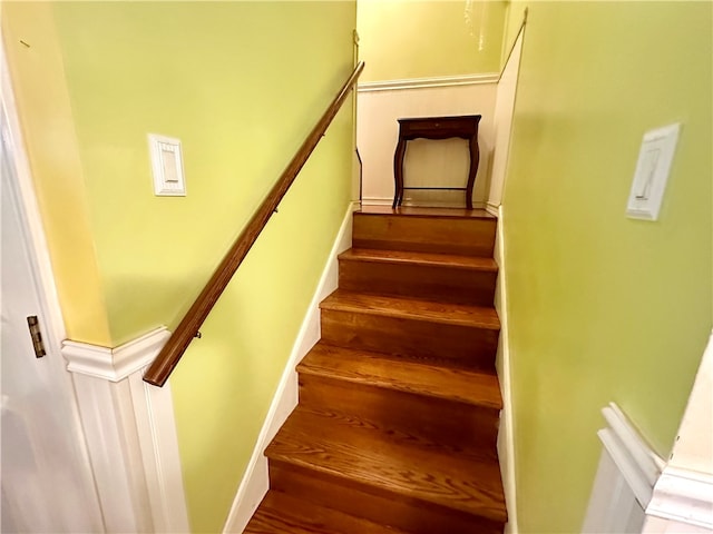 stairs with hardwood / wood-style flooring