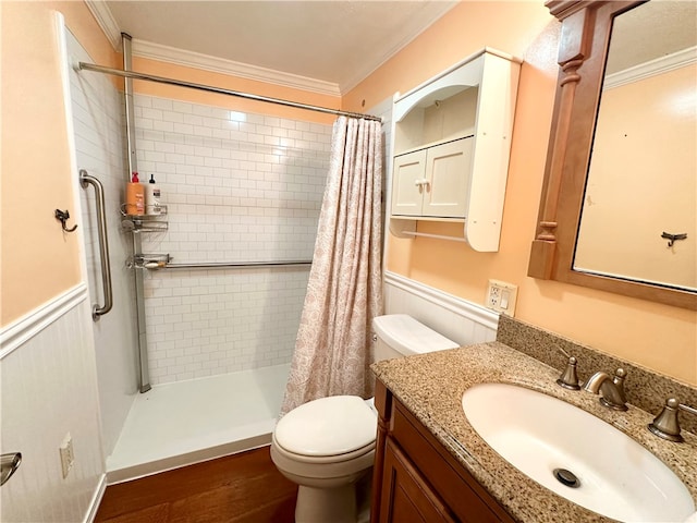 bathroom featuring ornamental molding, vanity, hardwood / wood-style flooring, toilet, and curtained shower