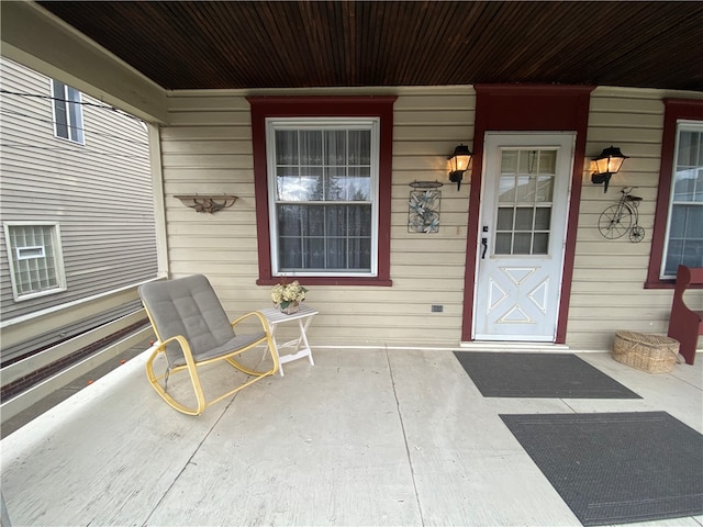 view of exterior entry with covered porch