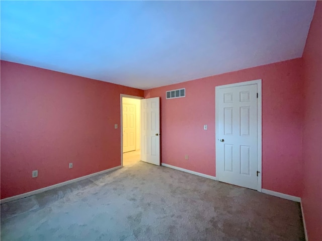 unfurnished bedroom featuring light colored carpet