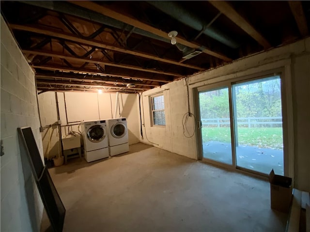 basement with separate washer and dryer and sink