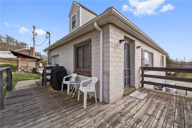 wooden deck with area for grilling