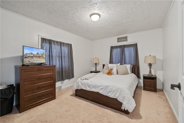 carpeted bedroom featuring a textured ceiling