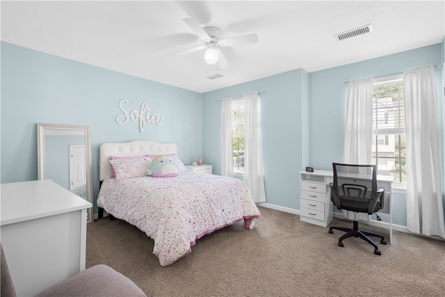 bedroom with carpet floors, multiple windows, and ceiling fan