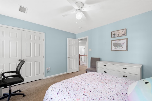 carpeted bedroom with ceiling fan and a closet