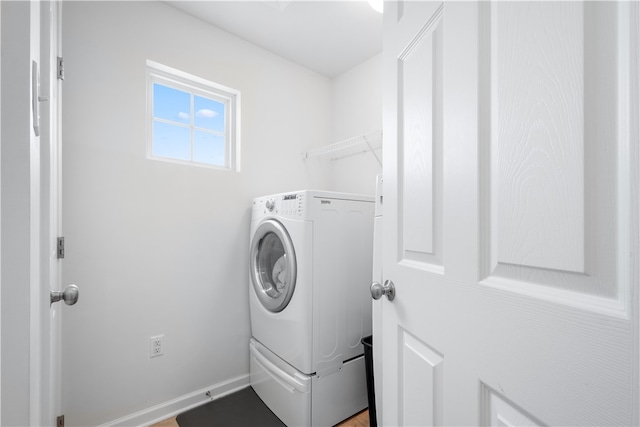 laundry room featuring washer / dryer