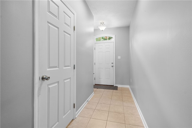 doorway featuring light tile patterned floors