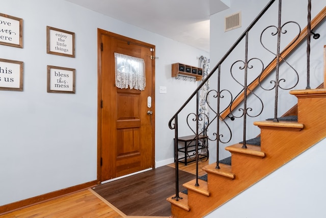 foyer with light hardwood / wood-style floors