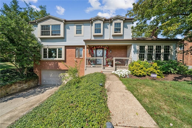 view of front facade featuring a porch and a garage