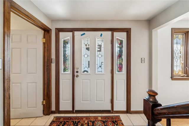 tiled foyer featuring plenty of natural light