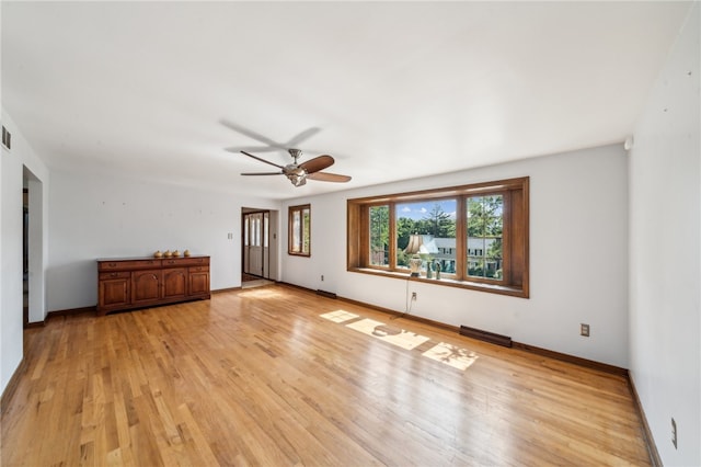 unfurnished room with light hardwood / wood-style flooring and ceiling fan