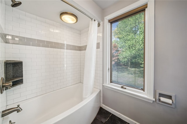 bathroom with tile patterned flooring and shower / bath combination with curtain