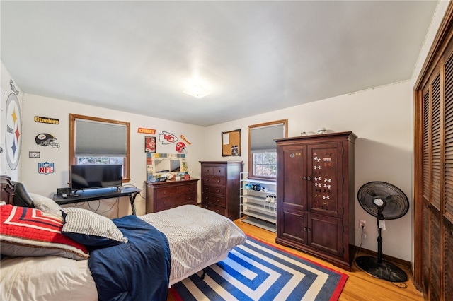 bedroom featuring a closet and light hardwood / wood-style flooring