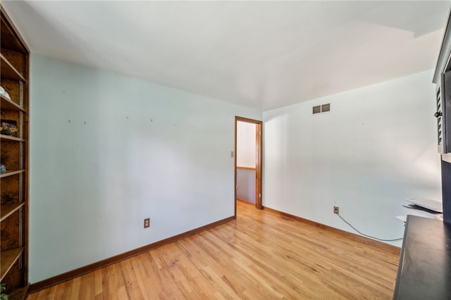 spare room with light hardwood / wood-style floors