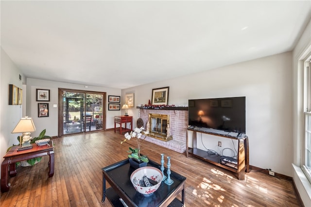 living room with a fireplace and hardwood / wood-style floors