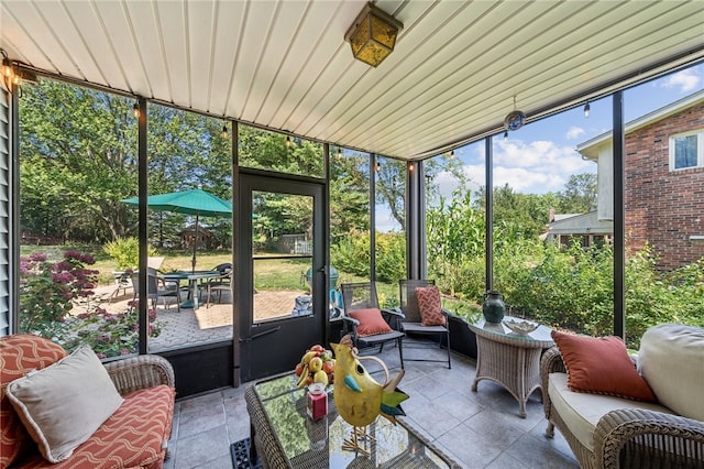 sunroom with wooden ceiling