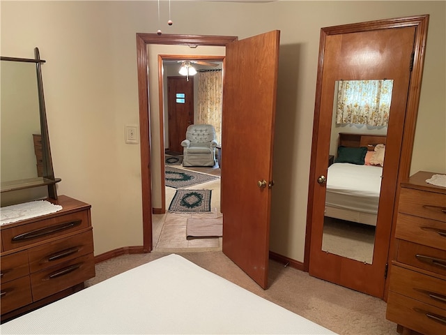 bedroom featuring light colored carpet