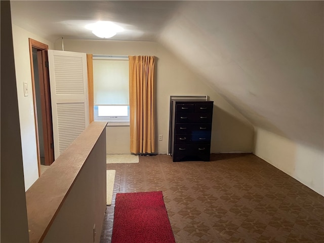 bonus room featuring lofted ceiling