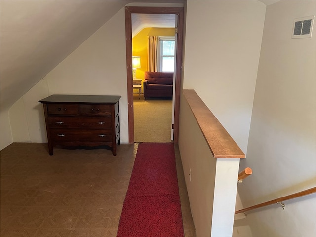 hallway with vaulted ceiling