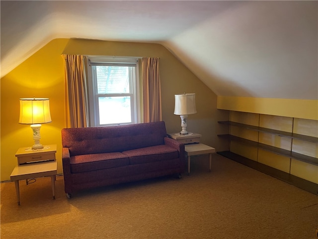 interior space with carpet flooring and vaulted ceiling