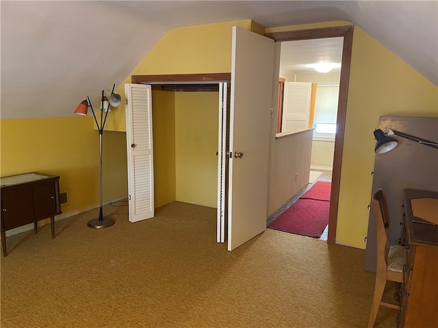 bonus room with carpet and lofted ceiling