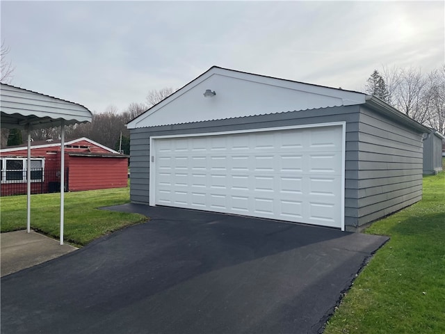 garage with a yard