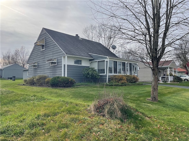 ranch-style home with a sunroom and a front yard