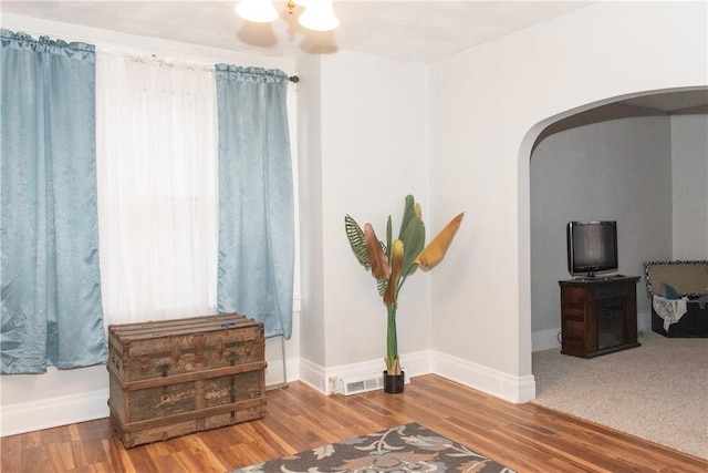 living area with hardwood / wood-style floors