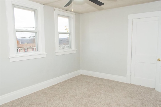 empty room with carpet and ceiling fan