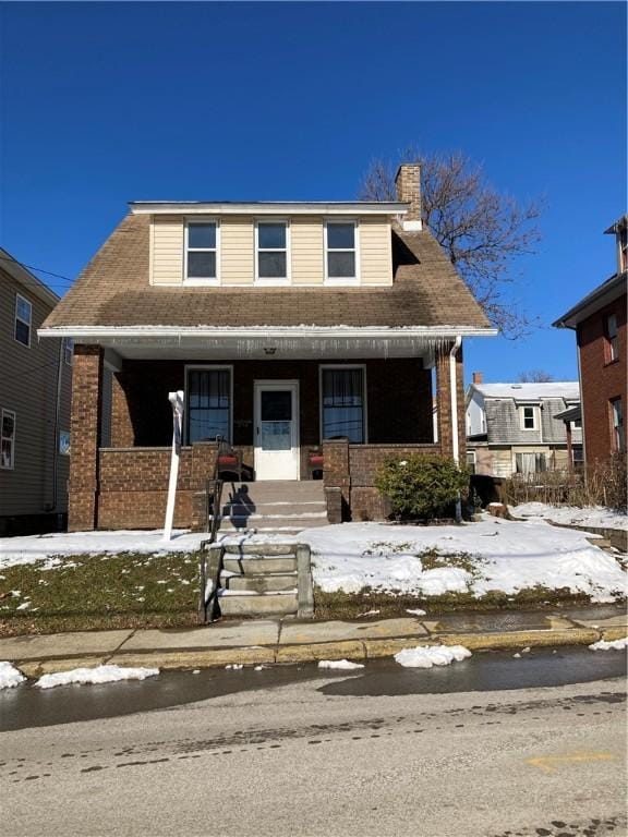 view of front of property featuring covered porch