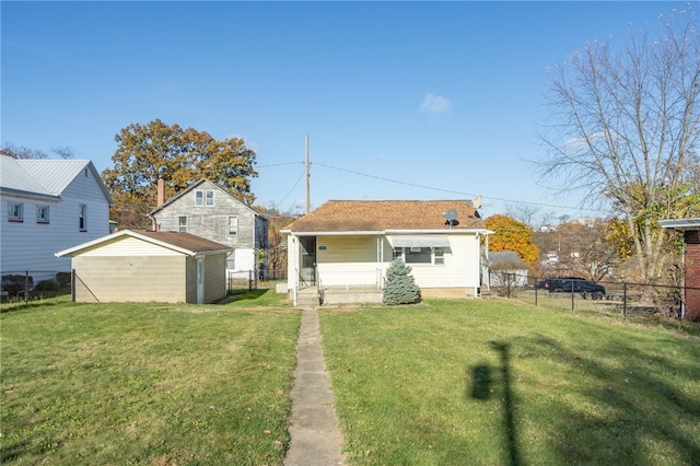 back of house with a yard