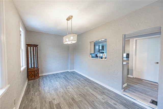 unfurnished room featuring hardwood / wood-style floors